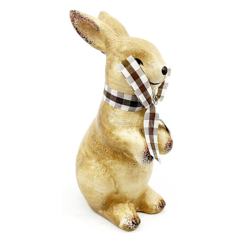 Ceramic rabbit standing with raffia