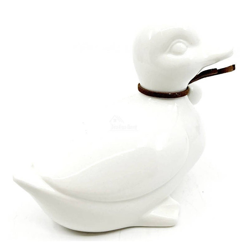Sitzende Ente aus Keramik mit Kopf nach rechts und Schleife