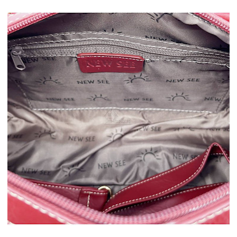 Helle Handtasche mit Pompon mit Katzenmotiv in Farbe