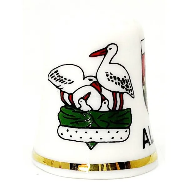 Fingerhut aus Keramik mit elsässischem Wappen, Storch und Elsässerin