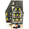 White Alsatian corner house with half-timbering in resin