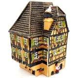 Orange Alsatian corner house with half-timbering in resin