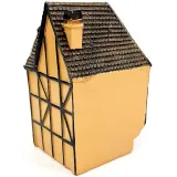 Orange Alsatian corner house with half-timbering in resin