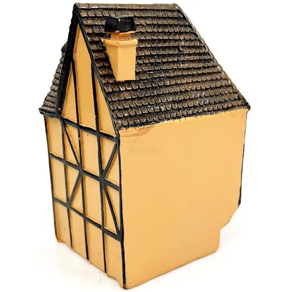 Orange Alsatian corner house with half-timbering in resin