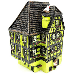 Green Alsatian corner house with half-timbering in resin