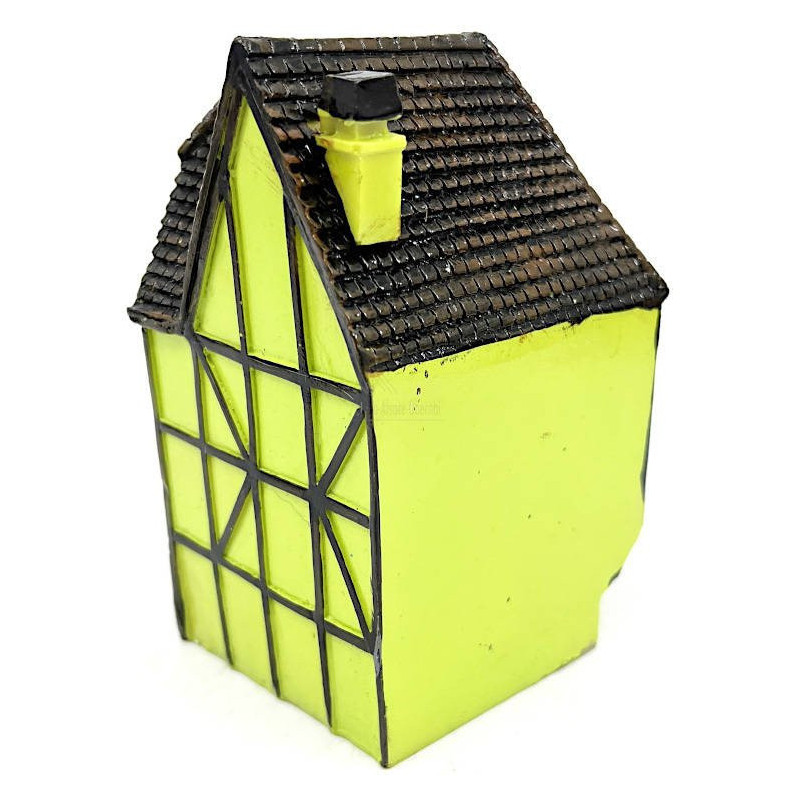 Green Alsatian corner house with half-timbering in resin