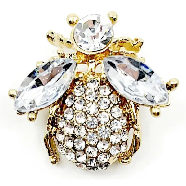 Fancy gold brooch with flying insect and rhinestones