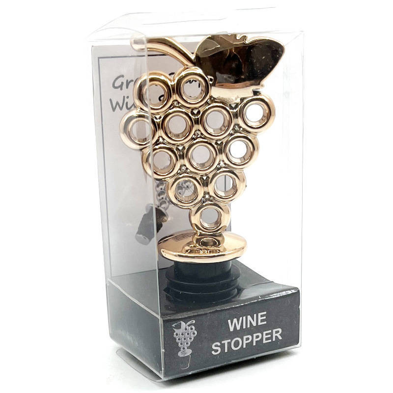 Golden wine stopper with bunch of grapes