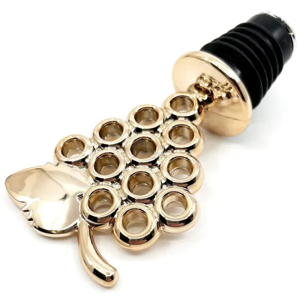 Golden wine stopper with bunch of grapes