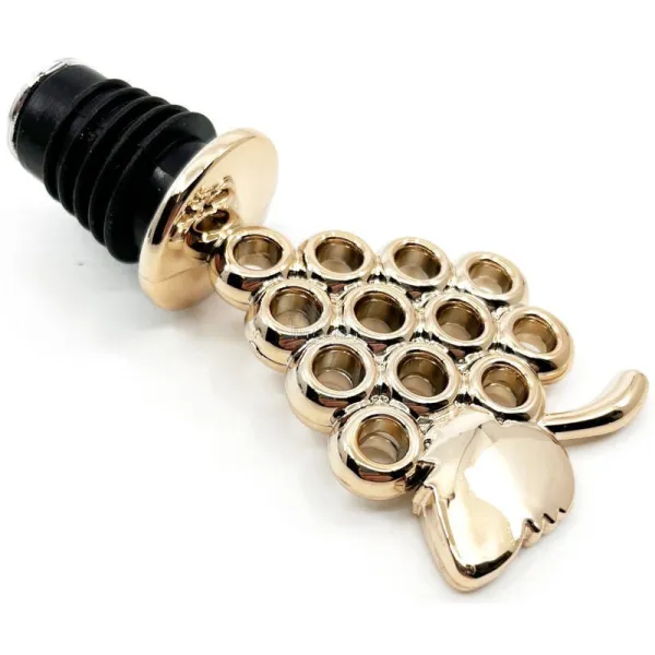 Golden wine stopper with bunch of grapes
