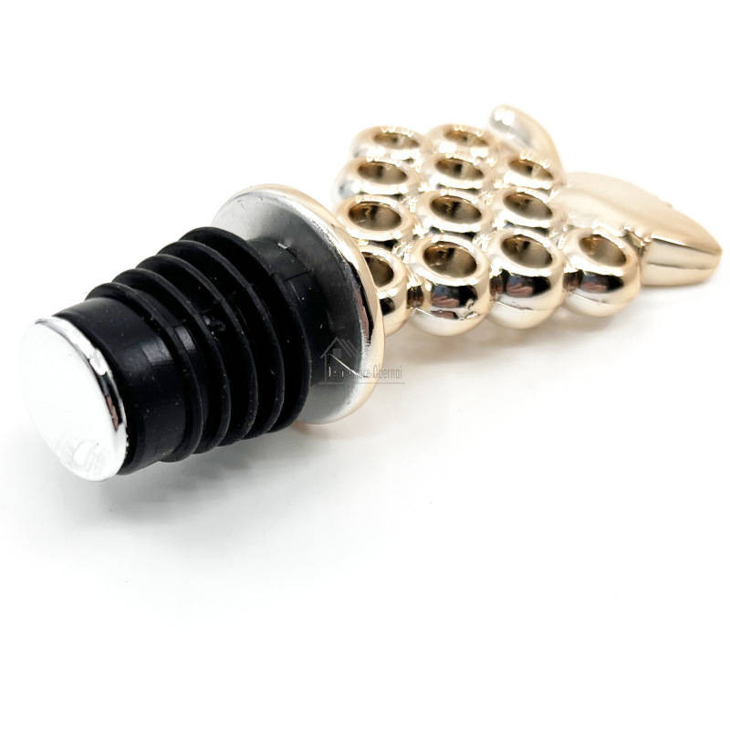 Golden wine stopper with bunch of grapes
