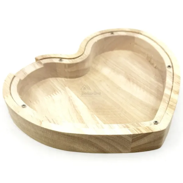 Heart-shaped money box in natural wood