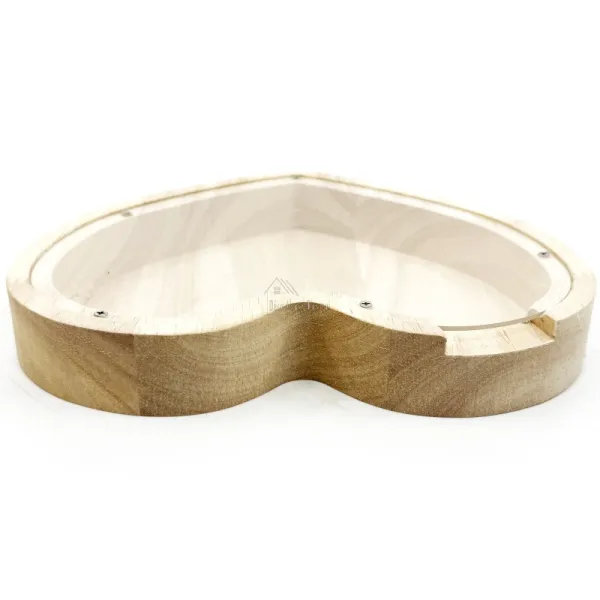 Heart-shaped money box in natural wood