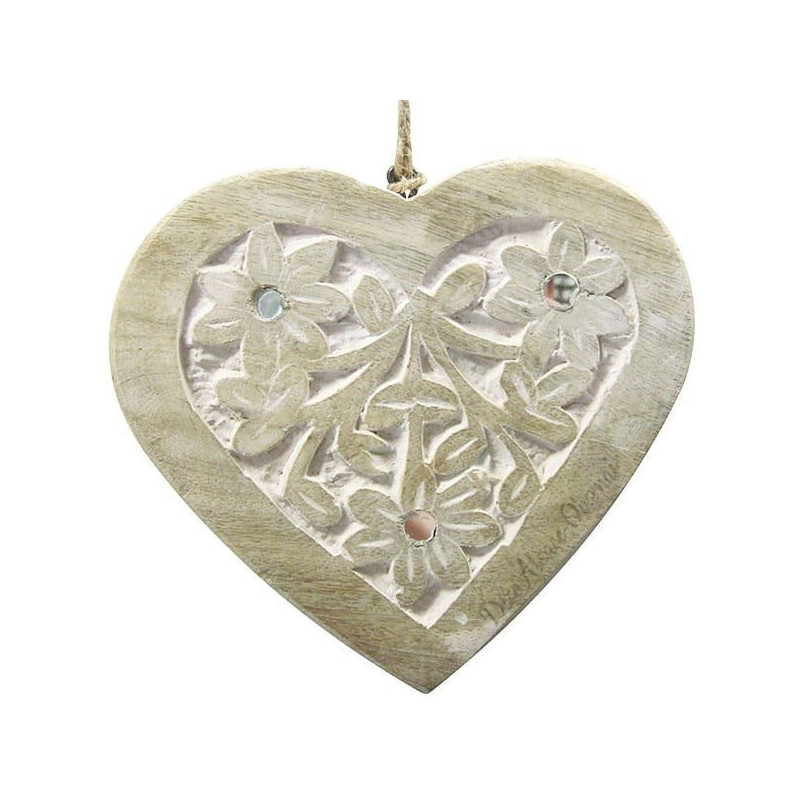 Solid wood heart carved on a white background decorated with mirrors