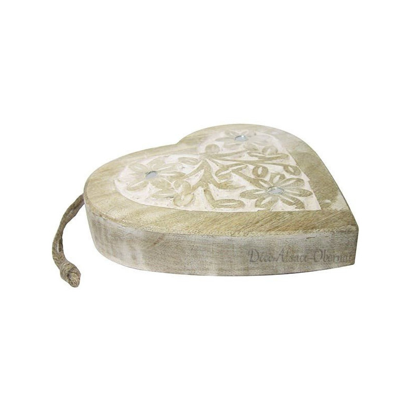 Solid wood heart carved on a white background decorated with mirrors