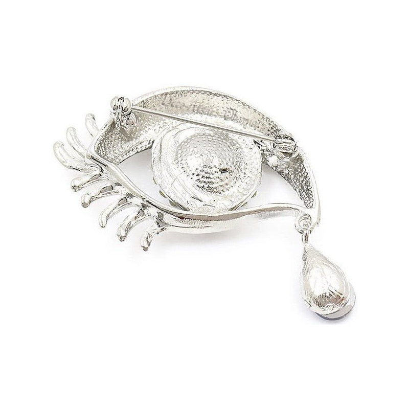 Golden fancy brooch in the shape of an eye set with rhinestones