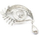 Golden fancy brooch in the shape of an eye set with rhinestones