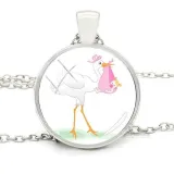 Necklace with pendant with curved glass white background and Alsatian stork