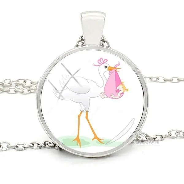 Necklace with pendant with curved glass white background and Alsatian stork