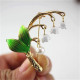 Broche Fantaisie dorée Brin de Muguet avec Perle et Clochettes