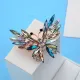 Broche dorée Fantaisie forme de Papillon en vol sertie de Strass