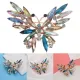 Broche dorée Fantaisie forme de Papillon en vol sertie de Strass