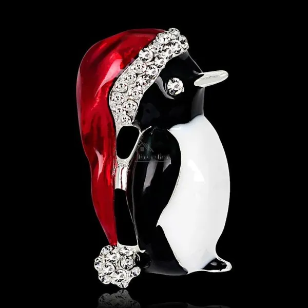 Fancy golden brooch Penguin red cap set with rhinestones