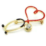 Broche dorée Fantaisie Stéthoscope avec Coeur Médecin sertie de Strass