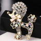 Broche Fantaisie métal doré Caniche avec Noeud