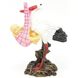 Resin stork carrying a baby in its beak 11 cm