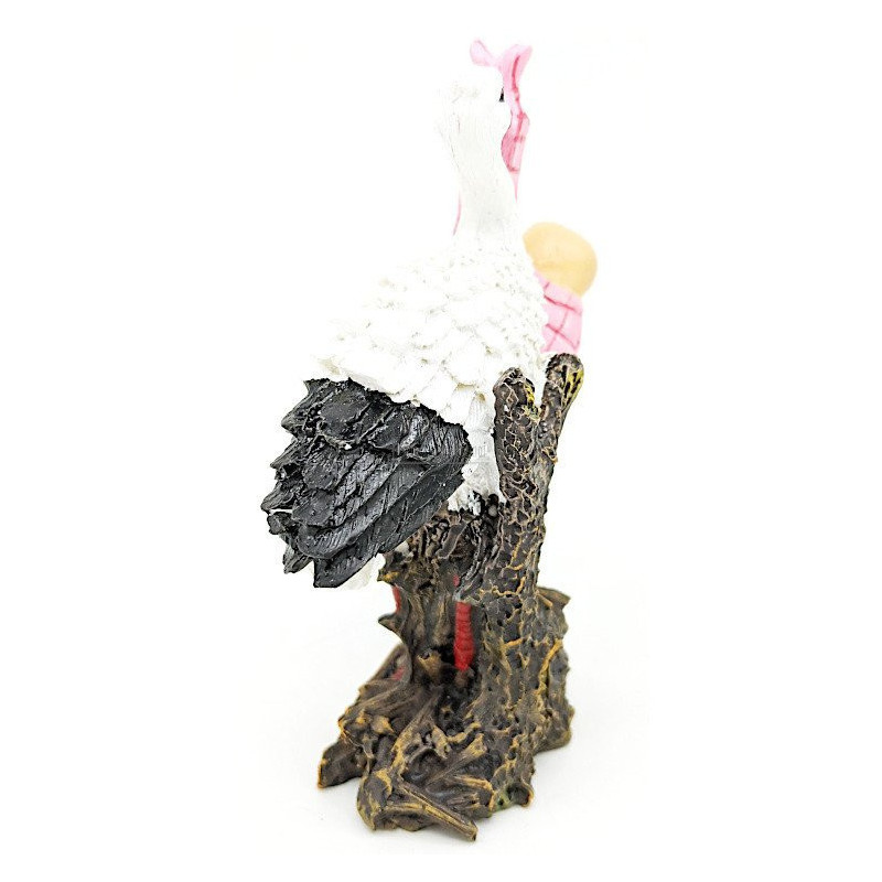 Resin stork carrying a baby in its beak 11 cm