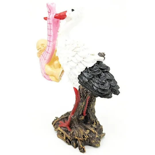 Cigogne en résine portant un bébé dans le bec 11 cm