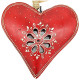 Red metal heart with openwork center and handmade decoration