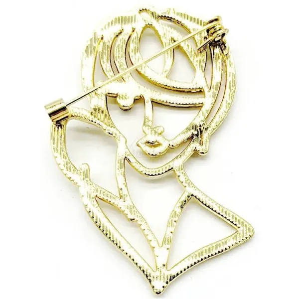 Broche Fantaisie dorée Buste et Visage et Oeil en Strass