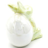 Green Ceramic Rabbit sitting against an Egg