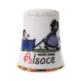 Ceramic thimble Hansi girl pulling a cart