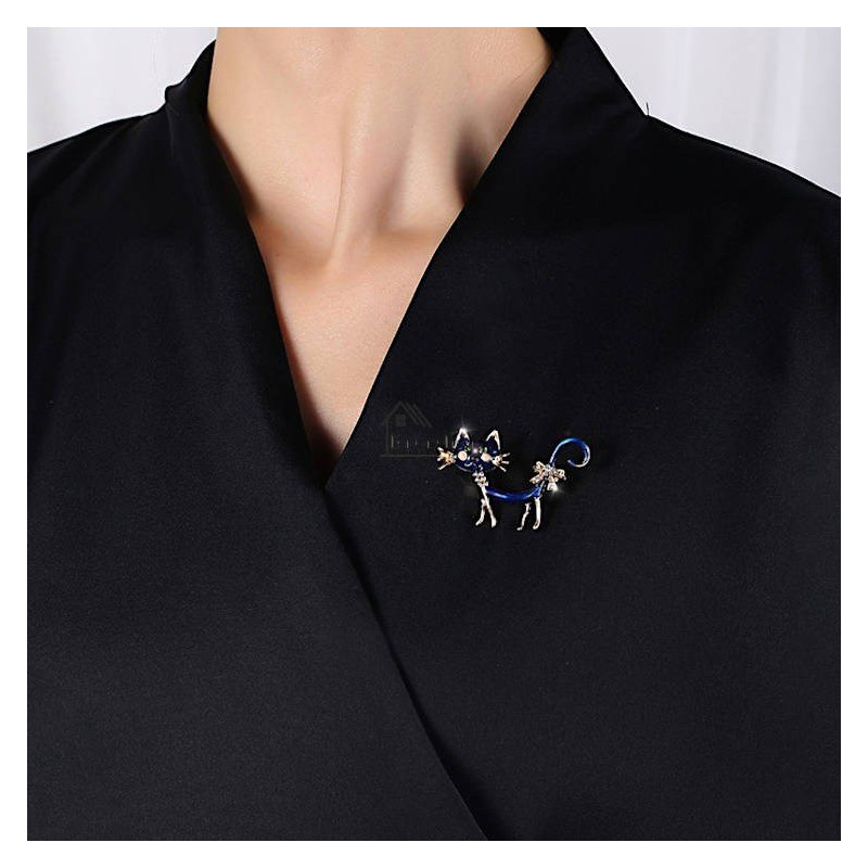 Fancy metal brooch with blue cat and rhinestones