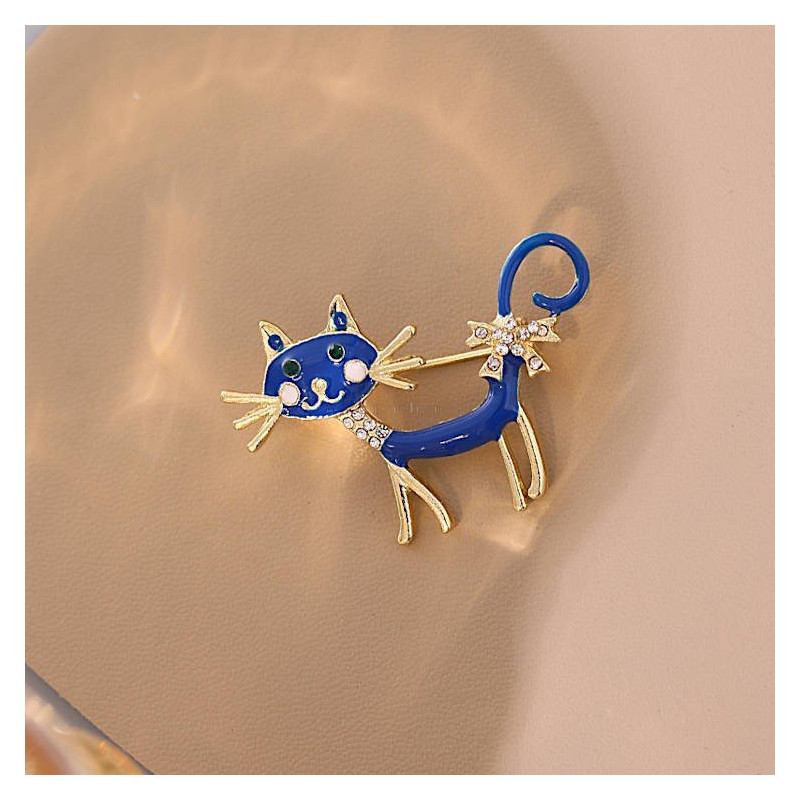 Fancy metal brooch with blue cat and rhinestones