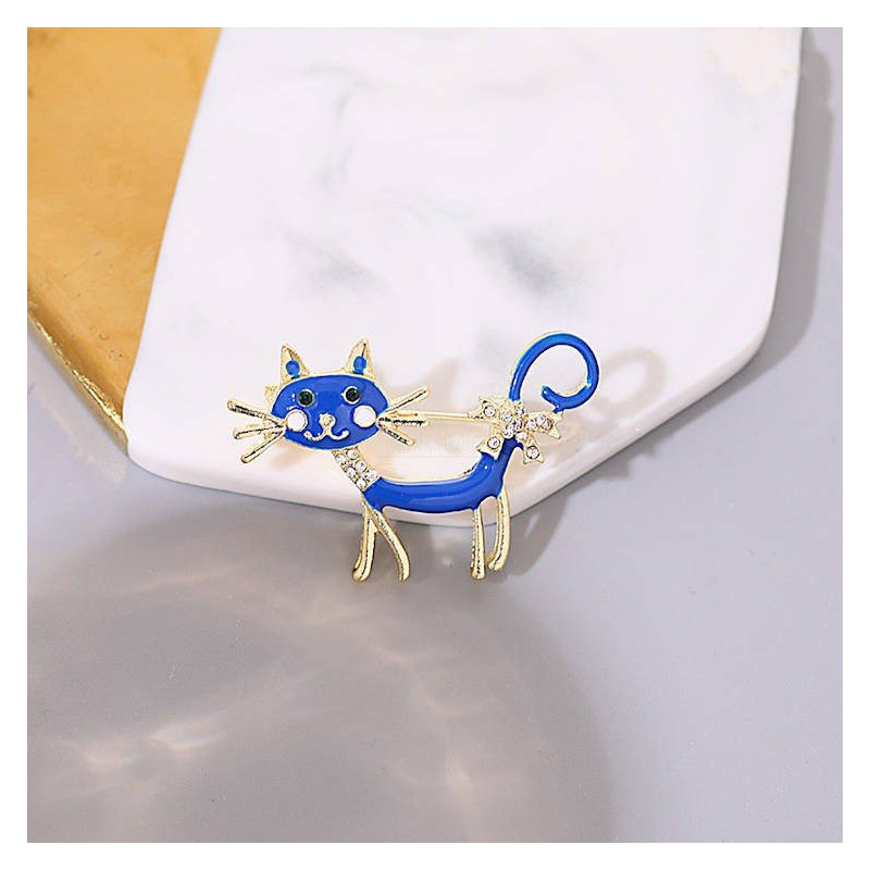 Fancy metal brooch with blue cat and rhinestones