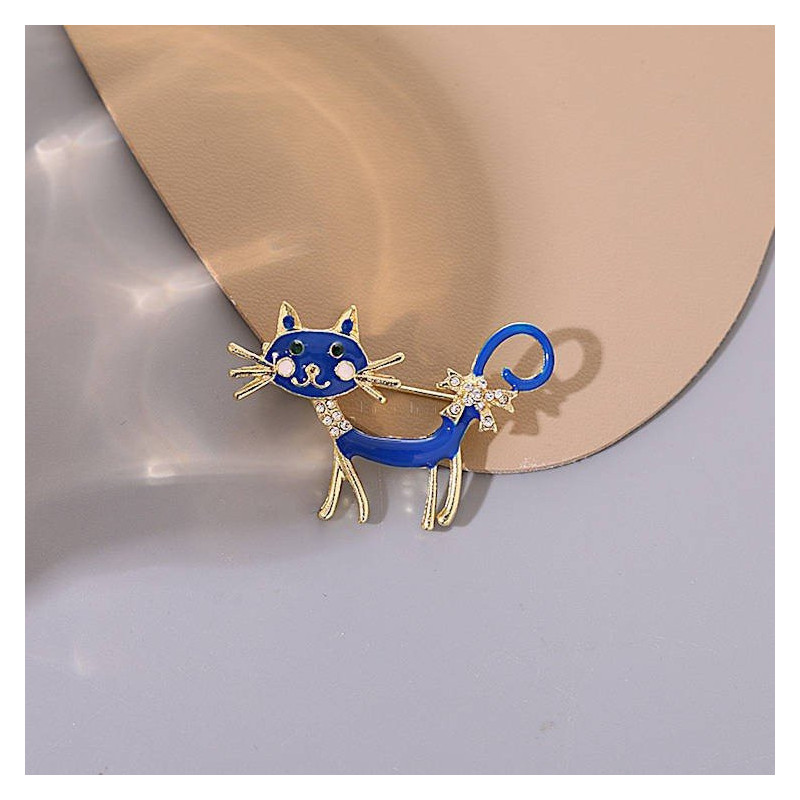 Fancy metal brooch with blue cat and rhinestones