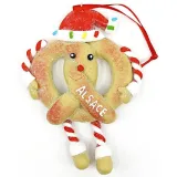 Hängende Lebkuchen-Brezel mit roter Schürze und Schleife