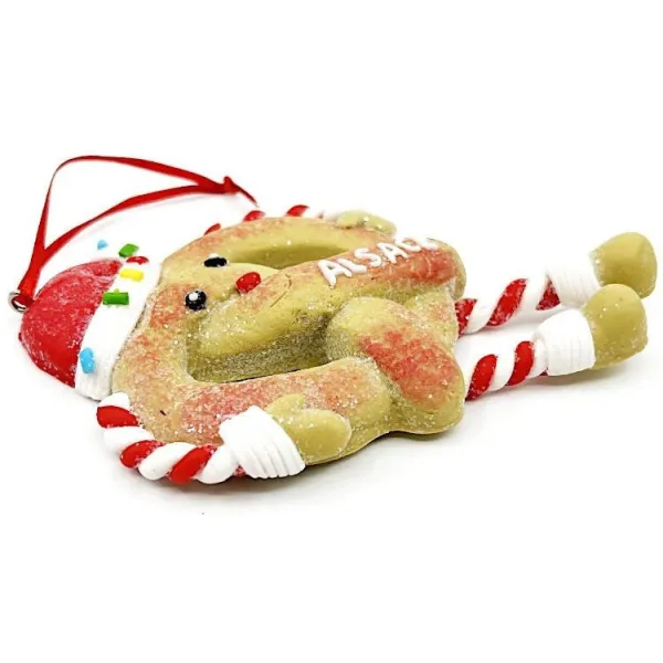 Hängende Lebkuchen-Brezel mit roter Schürze und Schleife